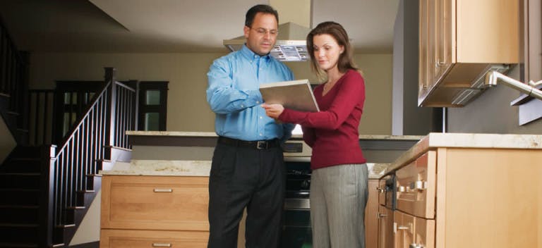Couple looking at a home checklist