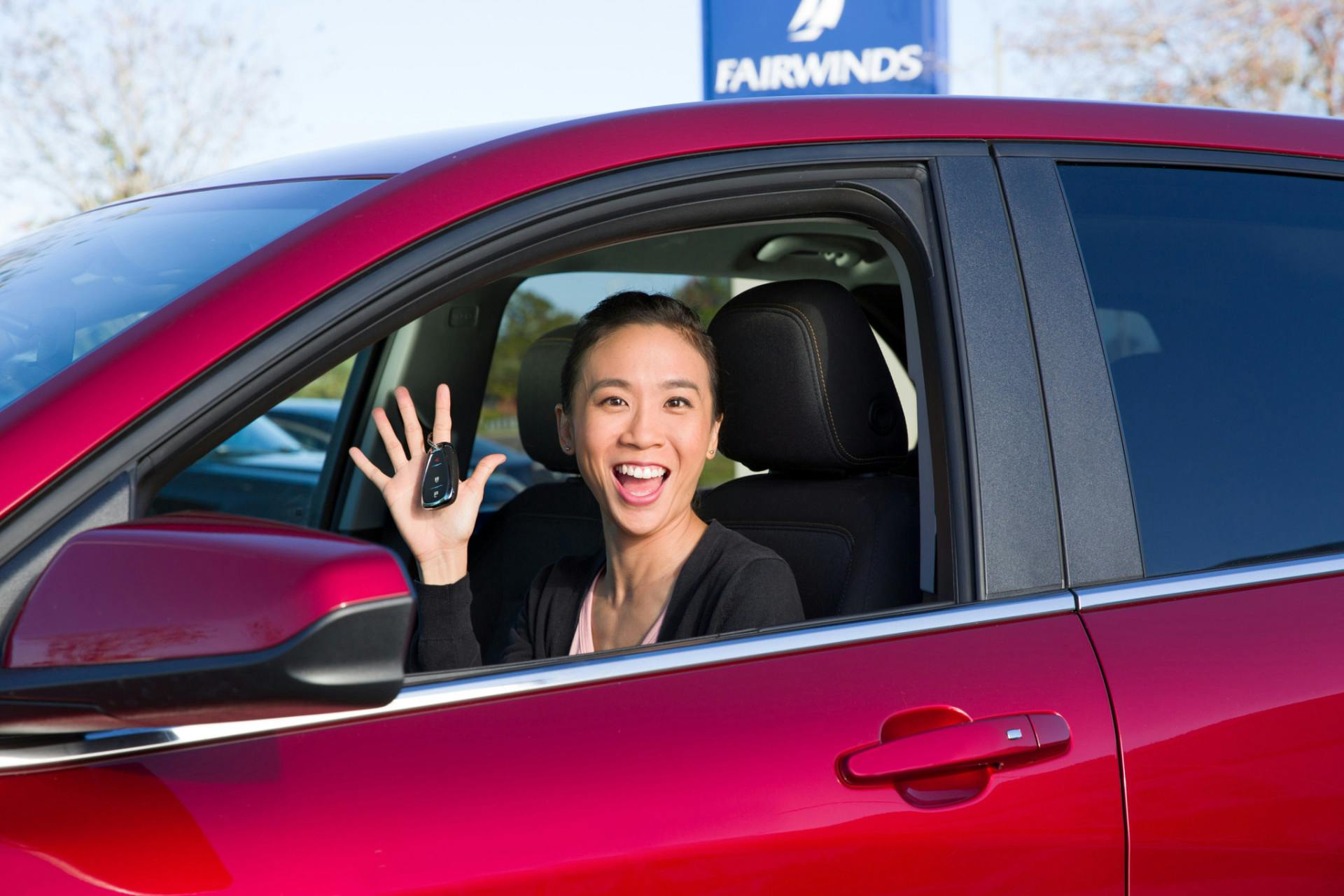 Woman purchasing a new car.